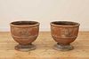 A pair of terracotta planters,