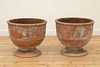 A pair of terracotta planters,