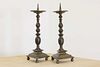 A pair of bronze pricket candlesticks,