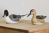 A pair of carved decoy ducks,