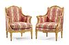 A pair of Louis XVI-style carved giltwood armchairs