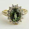 Lady's BHGL Appraised 2.35 Carat Oval Cut Green Tourmaline Yellow Gold Ring.