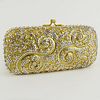 Judith Leiber Gold Tone Metal and Cystal Minaudiere Evening Clutch.