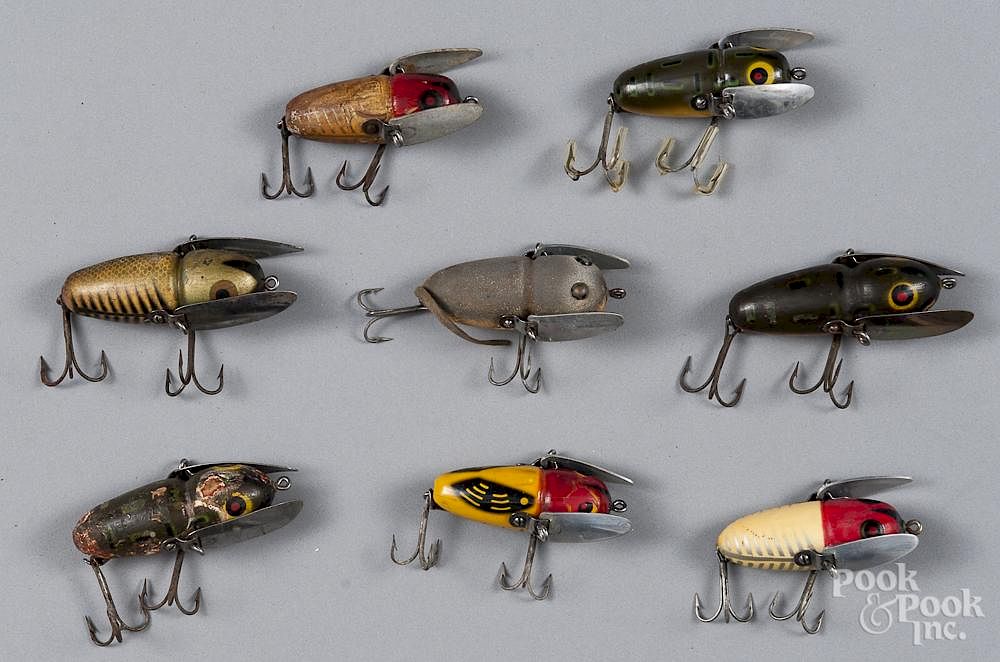 Eight Heddon crazy crawler wood fishing lures, to include a
