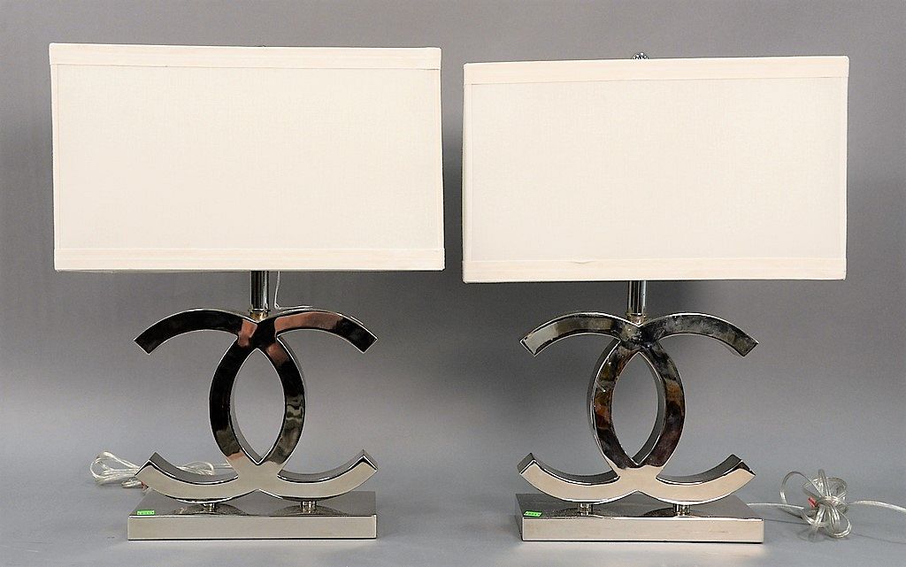 Pair of Chanel table lamps, stainless steel, with large CC design