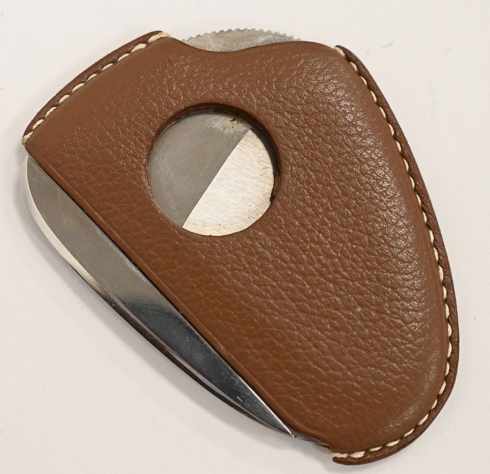 Hermes Leather Cigar Cutter, marked Hermes Paris and poe inox. sold at  auction on 25th September